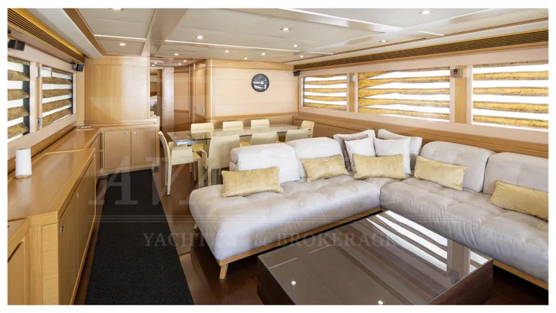 Yacht Photos Pics Luxurious interior of 2008 Ferretti Yachts Customline Navetta 26 with plush seating and dining area.