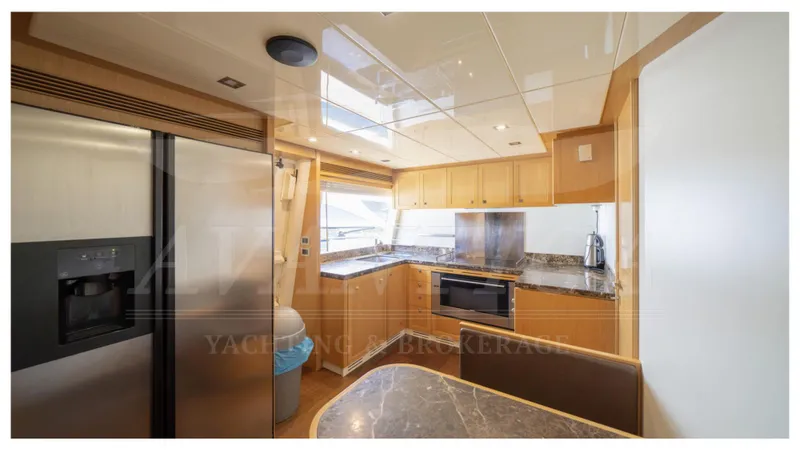  Yacht Photos Pics Luxurious kitchen interior of 2008 Ferretti Yachts Customline Navetta 26 with modern appliances.