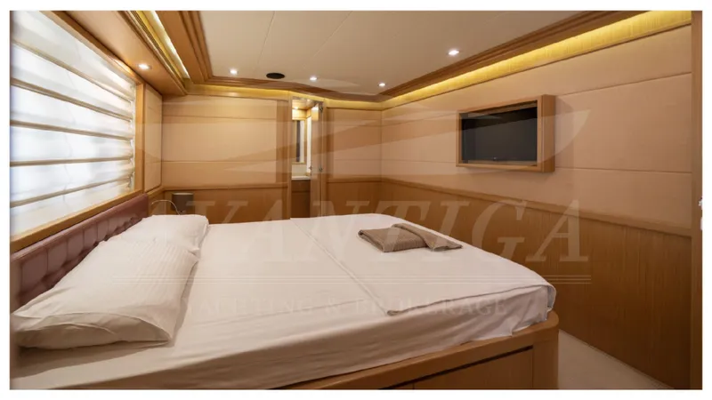  Yacht Photos Pics Luxurious bedroom interior of 2008 Ferretti Yachts Customline Navetta 26 with modern amenities.