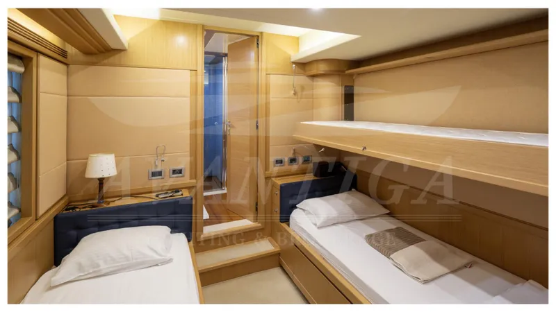  Yacht Photos Pics Luxurious cabin interior of 2008 Ferretti Yachts Customline Navetta 26 with twin beds.
