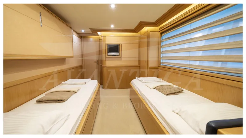  Yacht Photos Pics Luxurious twin cabin interior of 2008 Ferretti Yachts Customline Navetta 26 with modern decor.