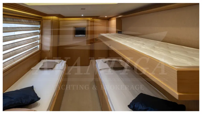  Yacht Photos Pics Luxurious cabin interior of 2008 Ferretti Yachts Customline Navetta 26 with twin beds.
