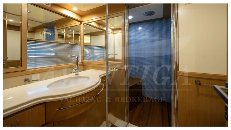  Yacht Photos Pics Luxurious bathroom in 2008 Ferretti Yachts Customline Navetta 26 with modern fixtures.