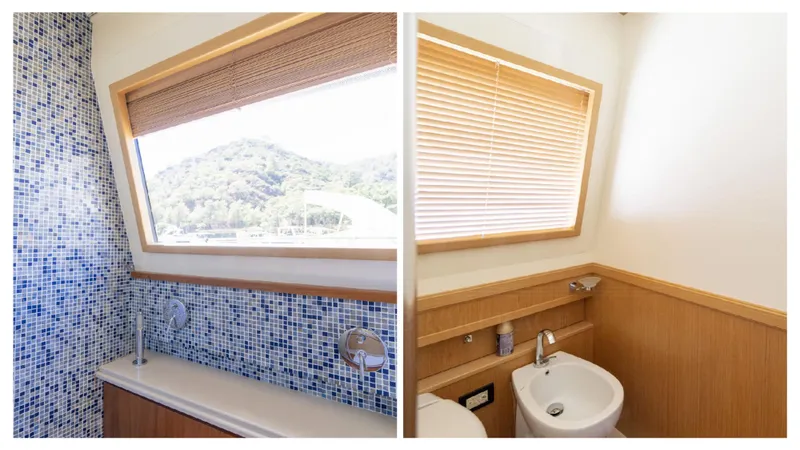  Yacht Photos Pics Luxurious bathroom interior of 2008 Ferretti Yachts Customline Navetta 26 with scenic window view.