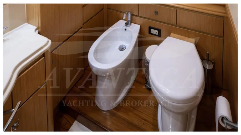  Yacht Photos Pics Luxurious bathroom in 2008 Ferretti Yachts Customline Navetta 26, featuring modern fixtures.
