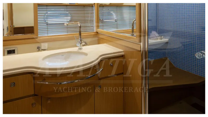  Yacht Photos Pics Luxurious bathroom in 2008 Ferretti Yachts Customline Navetta 26 with modern fixtures.