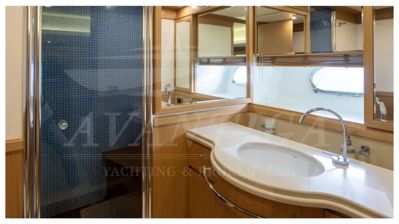  Yacht Photos Pics Luxurious bathroom in 2008 Ferretti Yachts Customline Navetta 26, featuring elegant fixtures and mirrors.