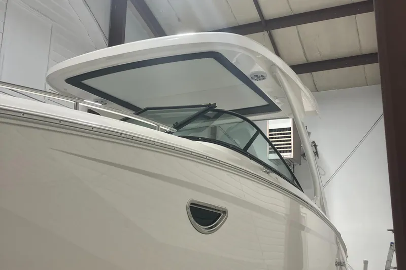  Yacht Photos Pics 2024 Regal 29 OBX boat in indoor storage, showcasing sleek design and modern features.