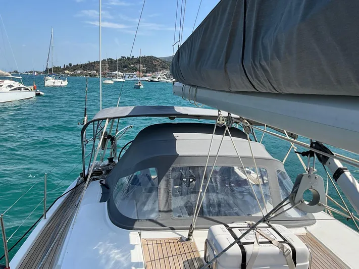 Starla Yacht Photos Pics Sailing yacht Hanse 445, 2012 model, docked in a vibrant marina.