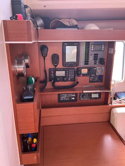 Starla Yacht Photos Pics Navigation equipment panel on a 2012 Hanse 445 sailboat, featuring radios and control systems.