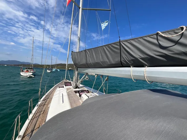 Starla Yacht Photos Pics Sailing yacht Hanse 445, 2012 model, anchored in a scenic bay with clear blue skies.