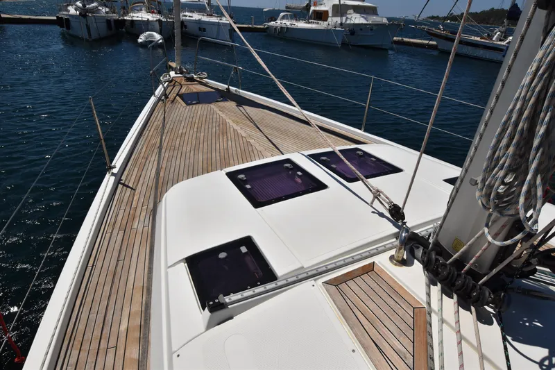 Starla Yacht Photos Pics Sailing yacht Hanse 445 (2012) with wooden deck, docked at marina.