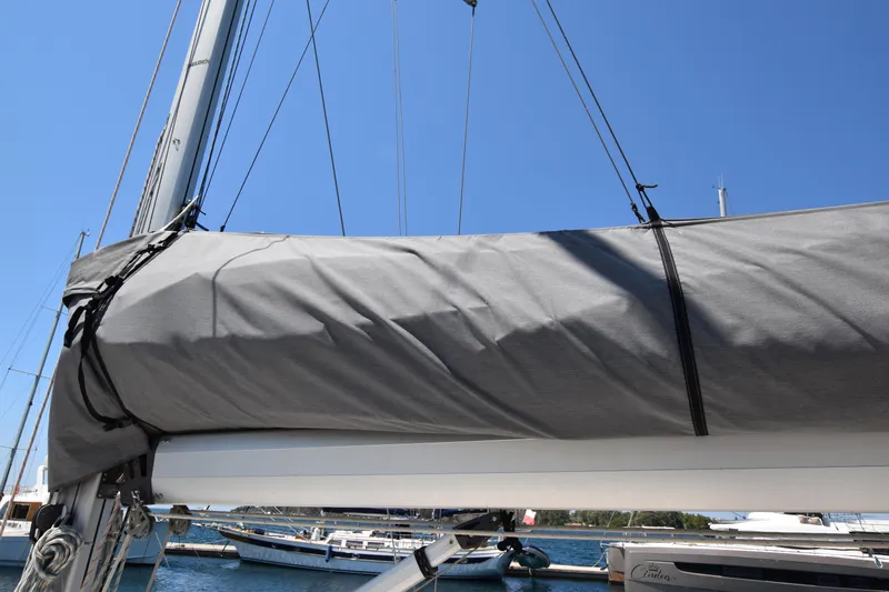 Starla Yacht Photos Pics Sailboat Hanse 445 (2012) with covered mainsail, docked in a marina under clear blue sky.