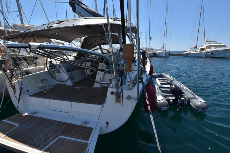 Starla Yacht Photos Pics Sailing yacht Hanse 445, 2012 model, docked with inflatable dinghy, sunny marina.