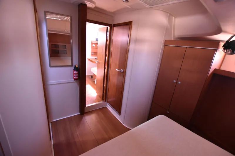 Starla Yacht Photos Pics Interior of 2012 Hanse 445 yacht, featuring wooden cabinetry and spacious cabin space.