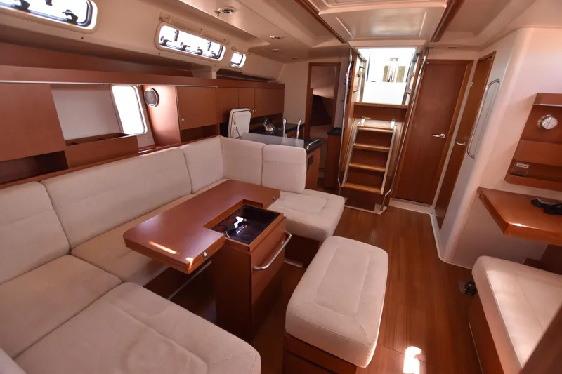 Starla Yacht Photos Pics Luxurious interior of 2012 Hanse 445 yacht with elegant wood finish and comfortable seating.