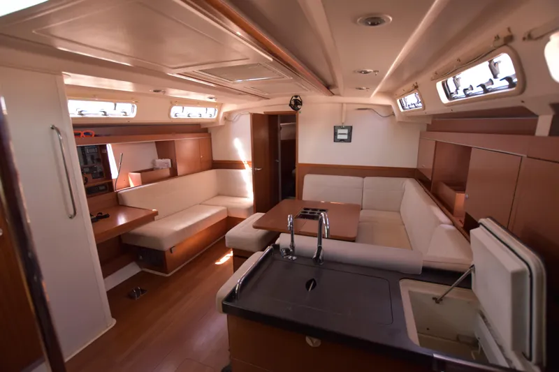 Starla Yacht Photos Pics Interior of 2012 Hanse 445 yacht with modern seating and kitchen area.