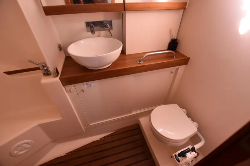 Starla Yacht Photos Pics Bathroom interior of 2012 Hanse 445 yacht with sink and toilet.