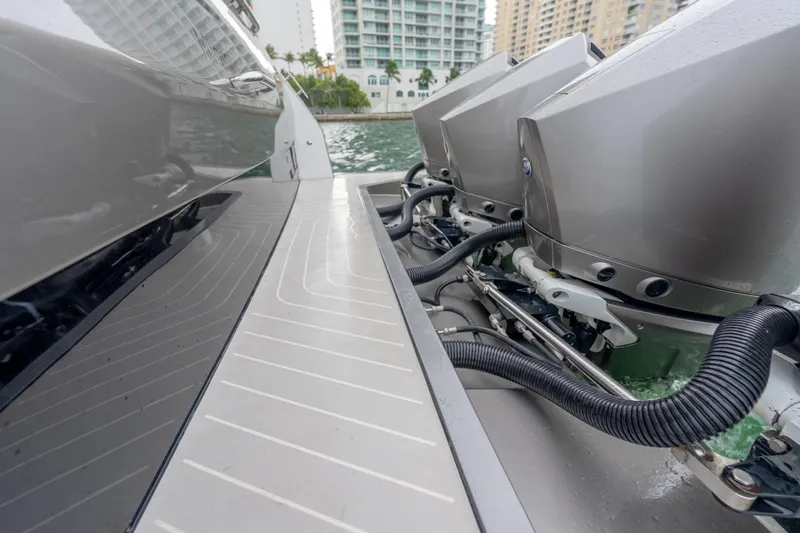 Azul Yacht Photos Pics 2021 Azimut Verve 47 boat engines and deck, docked near waterfront buildings.