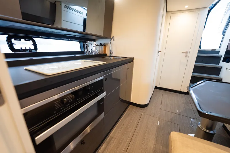 Azul Yacht Photos Pics Modern kitchen interior of 2021 Azimut Verve 47 yacht, featuring sleek cabinetry and appliances.