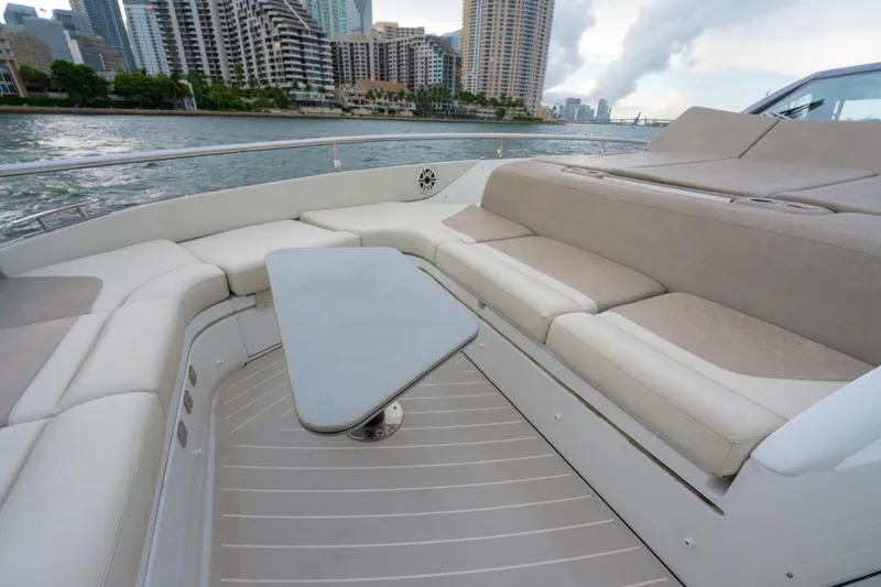 Azul Yacht Photos Pics Luxurious seating area on a 2021 Azimut Verve 47 yacht, with cityscape background.