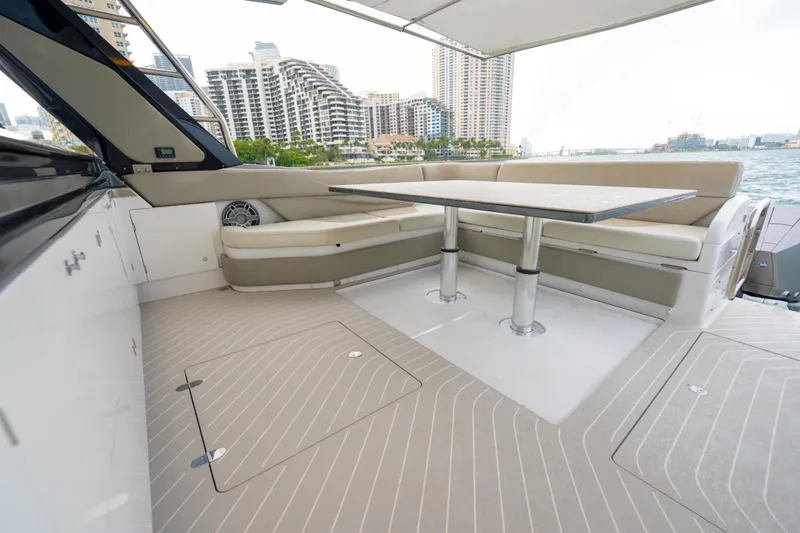 Azul Yacht Photos Pics Luxurious 2021 Azimut Verve 47 yacht interior with elegant seating and table, cityscape view.