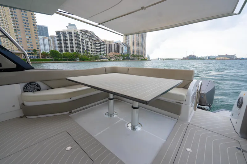 Azul Yacht Photos Pics Luxury seating area on 2021 Azimut Verve 47 yacht with cityscape view.