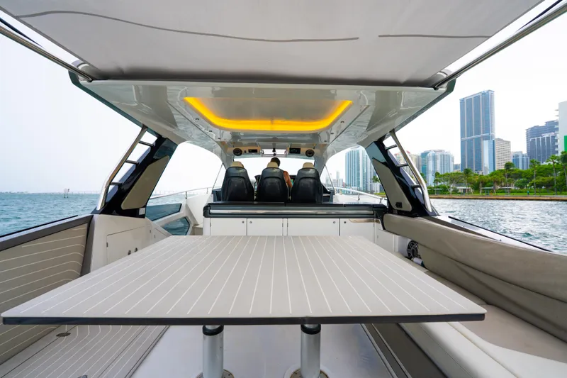 Azul Yacht Photos Pics Azimut Verve 47 yacht interior, 2021 model, with modern seating and city skyline view.