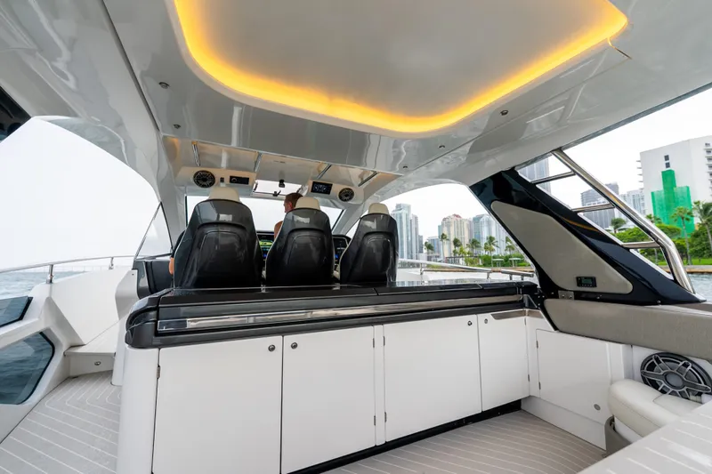 Azul Yacht Photos Pics 2021 Azimut Verve 47 yacht interior with modern seating and city skyline view.