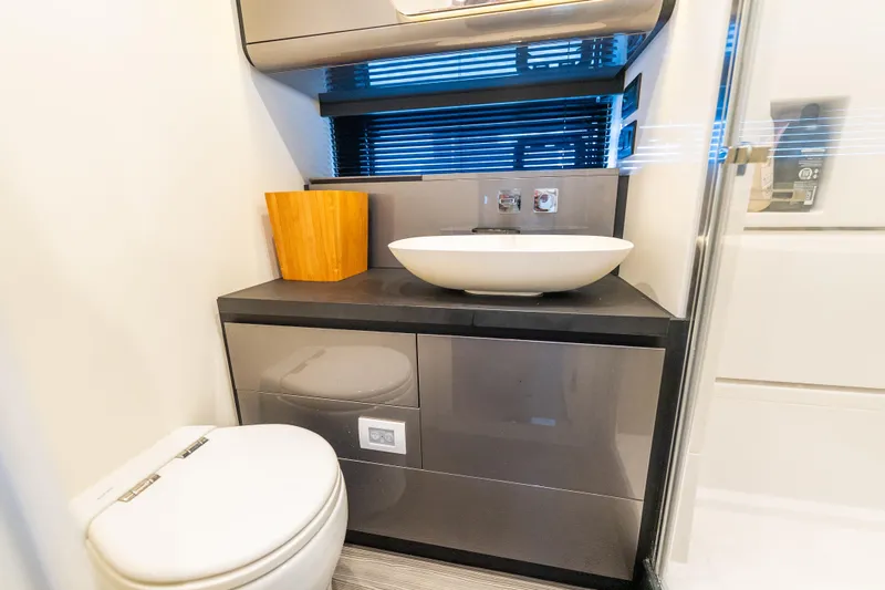 Azul Yacht Photos Pics Modern bathroom interior on 2021 Azimut Verve 47 yacht, featuring sleek sink and toilet.
