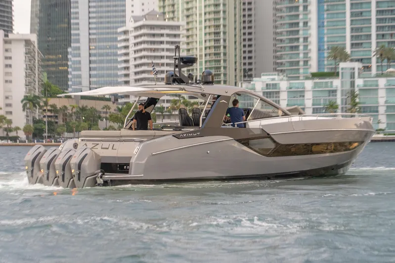 Azul Yacht Photos Pics 2021 Azimut Verve 47 yacht cruising in urban waterfront setting.