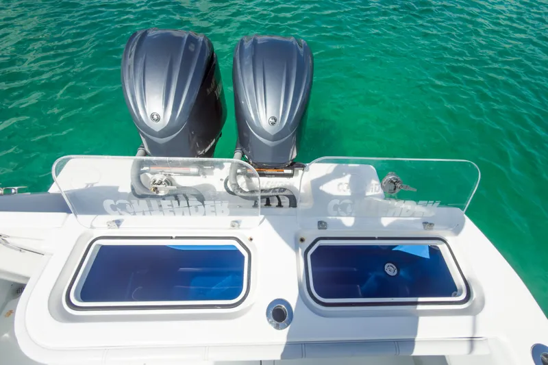 No Name Yacht Photos Pics 2023 Contender 32 ST boat with dual engines on turquoise water.