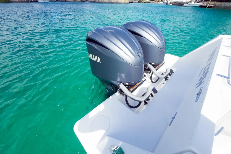No Name Yacht Photos Pics 2023 Contender 32 ST boat with dual Yamaha outboard engines on turquoise water.
