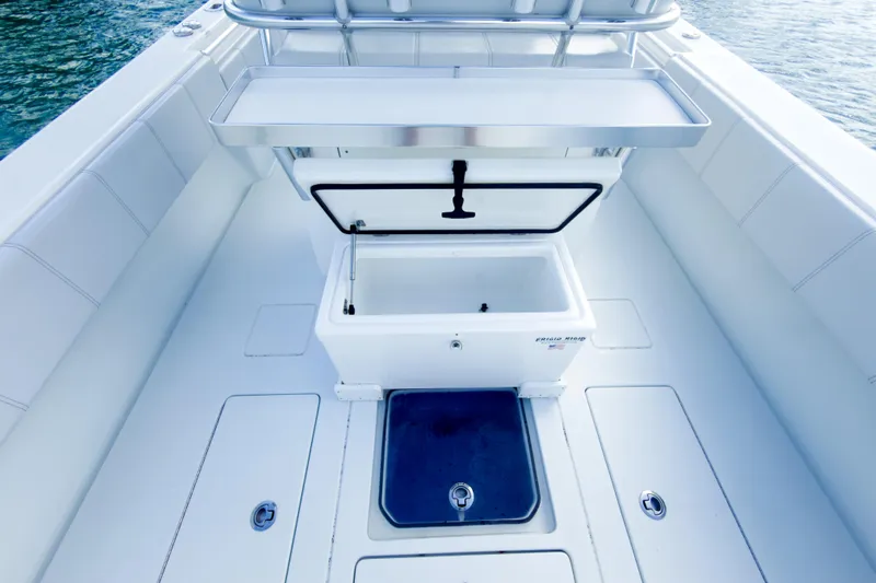 No Name Yacht Photos Pics 2023 Contender 32 ST boat interior with open storage compartment on deck.