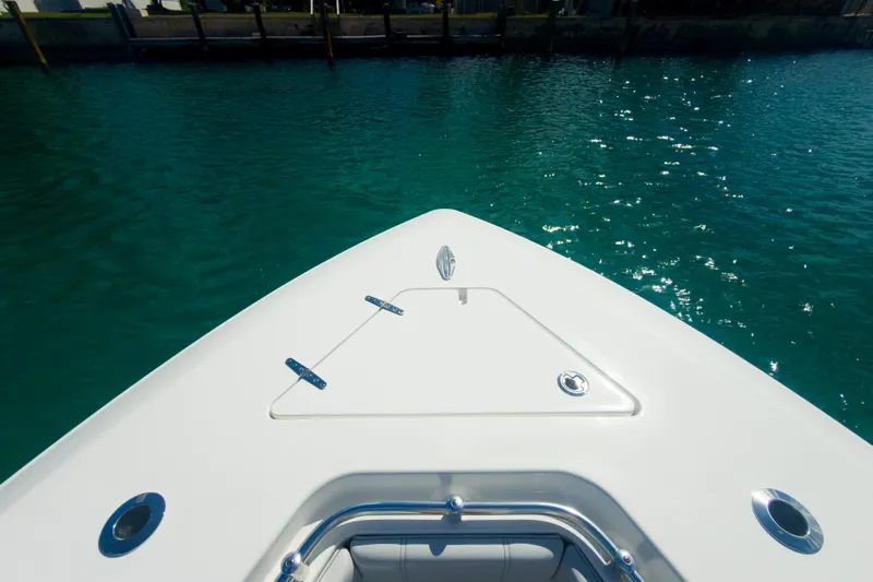 No Name Yacht Photos Pics 2023 Contender 32 ST boat bow on clear blue water.