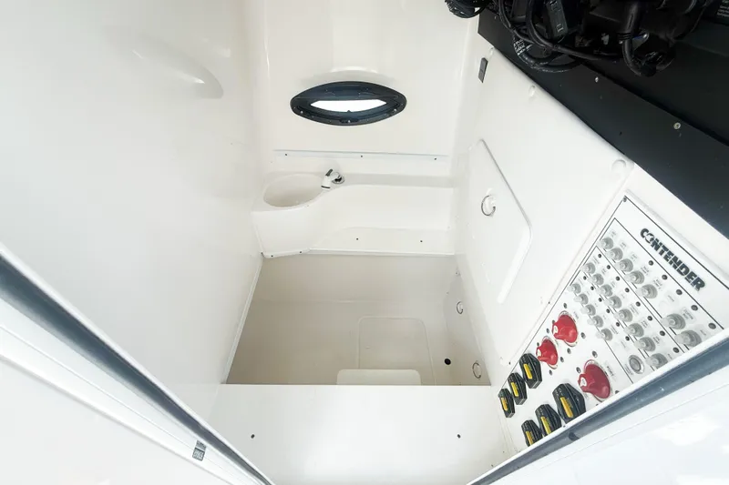 No Name Yacht Photos Pics 2023 Contender 32 ST boat interior with control panel and compact sink.