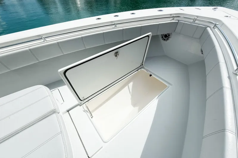 No Name Yacht Photos Pics 2023 Contender 32 ST boat with open storage compartment, sleek white interior.
