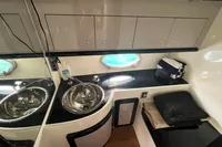 Luxurious 2007 Performance 1107 yacht interior with sink, storage, and porthole.