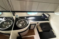 Luxurious 2007 Performance 1107 yacht interior with sleek sink and storage.