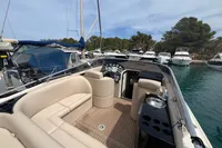 Luxurious 2007 Performance 1107 boat with beige seating, docked in a marina.