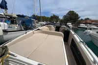Luxury 2007 Performance 1107 boat with spacious deck in marina setting.