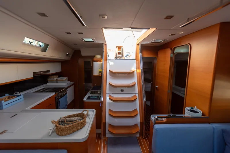  Yacht Photos Pics Luxurious interior of 2014 Italia Yachts 15.98, featuring modern kitchen and wooden finishes.