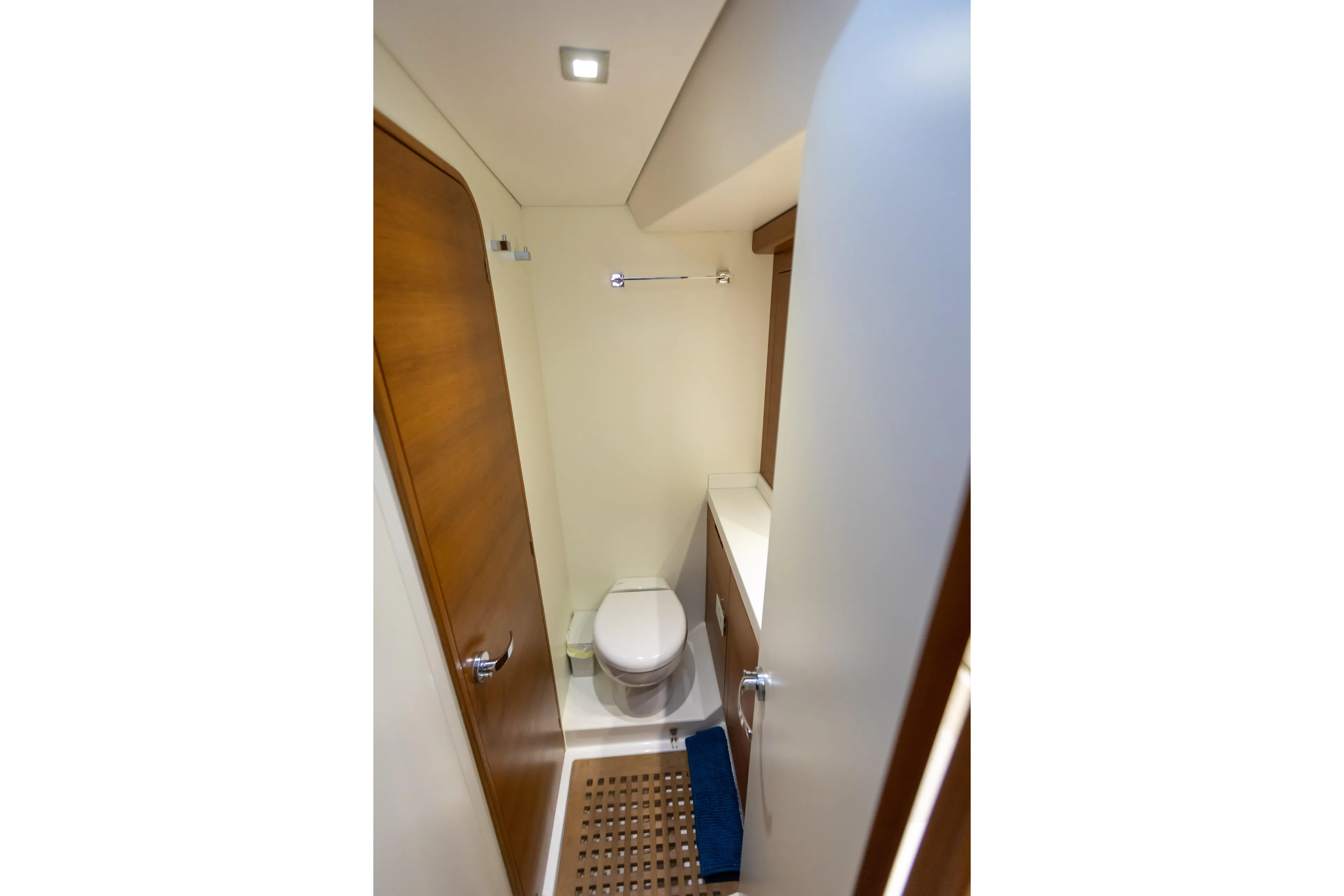  Yacht Photos Pics Bathroom interior of 2014 Italia Yachts 15.98, featuring modern fixtures and wooden accents.