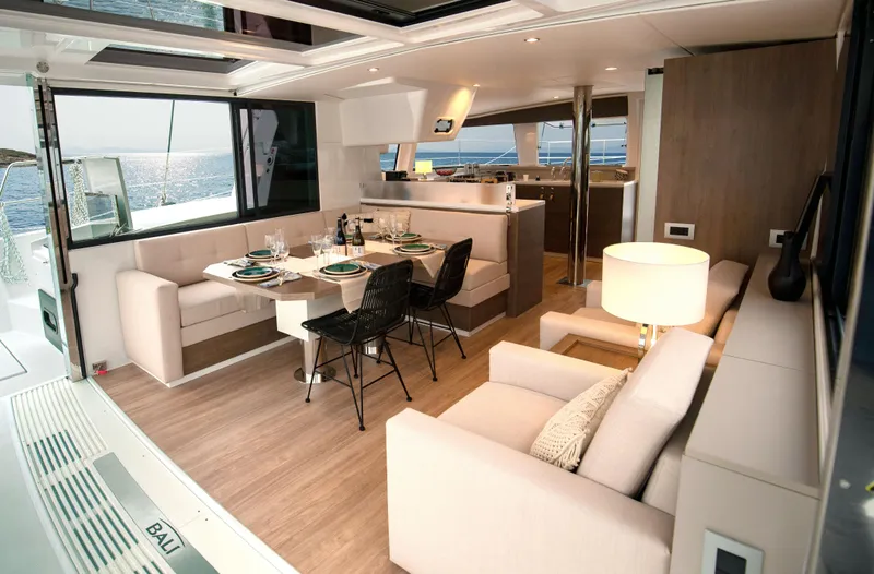  Yacht Photos Pics Luxurious interior of 2025 Bali 4.4 yacht with elegant dining and seating area.