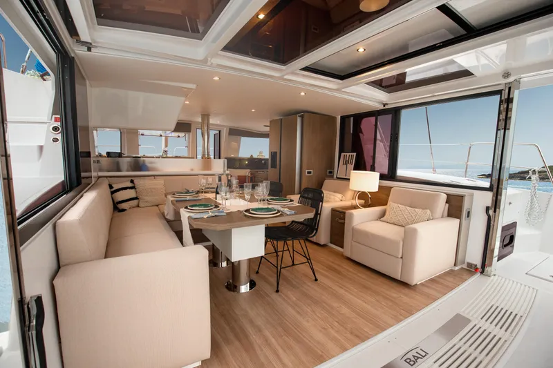  Yacht Photos Pics Luxurious interior of 2025 Bali 4.4 yacht with elegant dining area and modern furnishings.