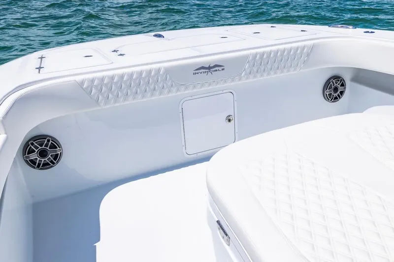  Yacht Photos Pics 2026 Invincible 36 Catamaran interior with white seating and ocean backdrop.