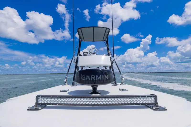  Yacht Photos Pics Invincible 36 Catamaran 2026 on open water, featuring Garmin equipment under a clear blue sky.
