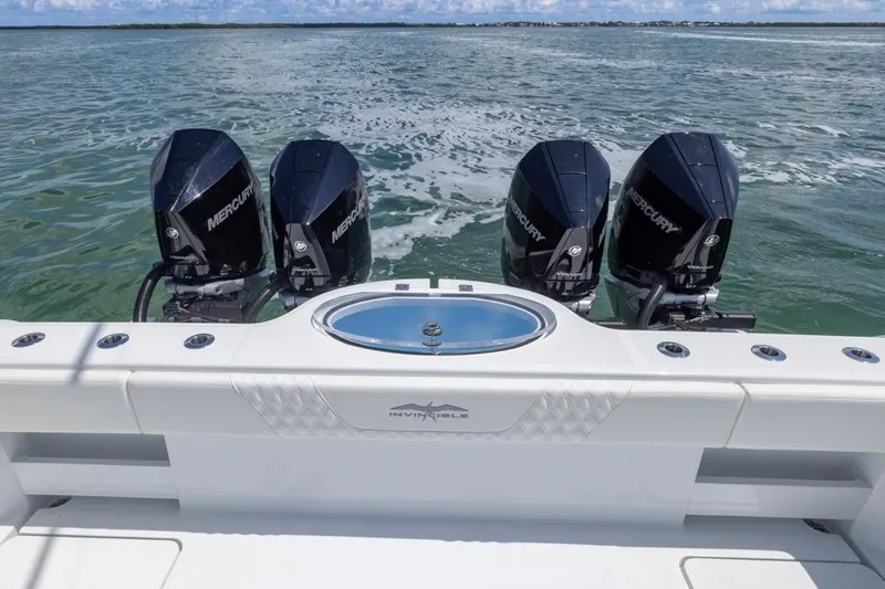  Yacht Photos Pics 2026 Invincible 36 Catamaran with four Mercury engines on open water.