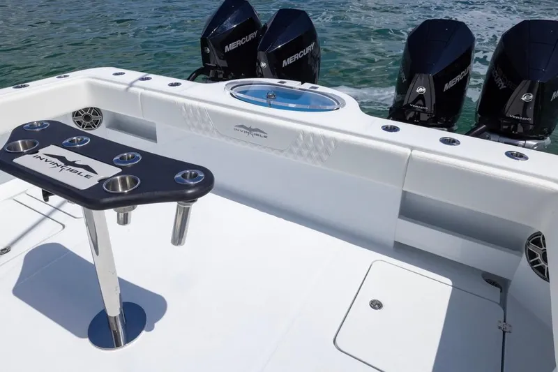  Yacht Photos Pics 2026 Invincible 36 Catamaran with Mercury engines, featuring a sleek fishing setup.