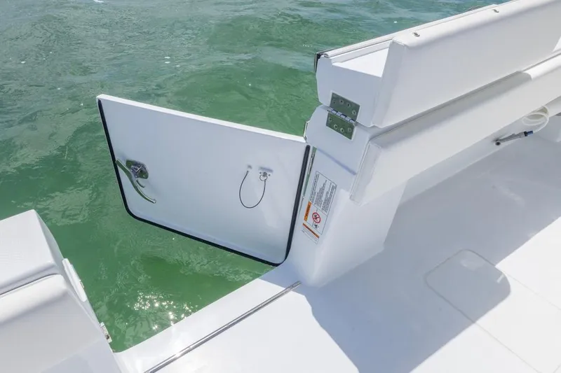  Yacht Photos Pics 2026 Invincible 36 Catamaran with open side door, showcasing sleek design and ocean view.